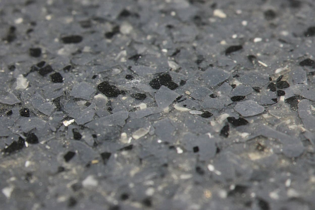 Cured polyaspartic film over flake texture.